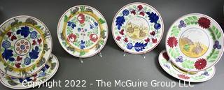 Collection of Hand-Painted Porcelain Plates in Various Designs.