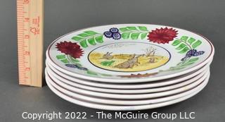 Collection of Hand-Painted Porcelain Plates in Various Designs.