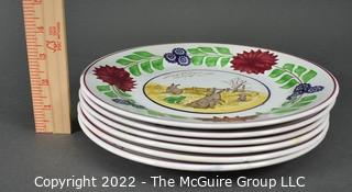 Collection of Hand-Painted Porcelain Plates in Various Designs.