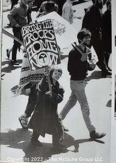 Assortment of books including a photographic compilation of the '60's