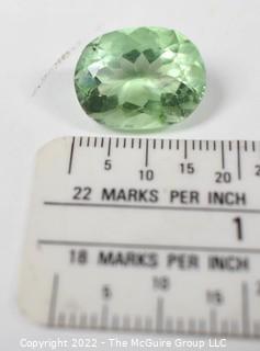 Group of Polished Stones Including One Loose 16Kt Green Peridot Gem Stone.