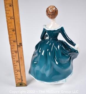 Royal Doulton Bone China Figurine  - Janine In Blue Gown Designed by J. Bromley. Issued 1971-1995. 8" tall.