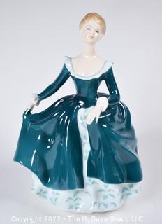 Royal Doulton Bone China Figurine  - Janine In Blue Gown Designed by J. Bromley. Issued 1971-1995. 8" tall.