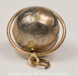 Vintage 14kt Yellow Gold Pierced and Articulated World Globe Charm or Pendant. 2.1 grams.