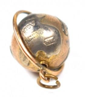 Vintage 14kt Yellow Gold Pierced and Articulated World Globe Charm or Pendant. 2.1 grams.