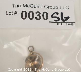 Vintage 14kt Yellow Gold Pierced and Articulated World Globe Charm or Pendant. 2.1 grams.