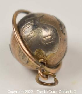 Vintage 14kt Yellow Gold Pierced and Articulated World Globe Charm or Pendant. 2.1 grams.