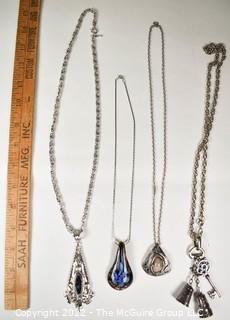 Four (4) Pendant Style Necklaces. 