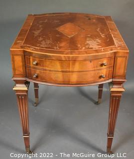 Two Drawer Sheraton Style Mahogany End Table With Inlay And Brass Pulls.  Damage to finish.  27"L x 27"H x 20"W