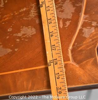 Two Drawer Sheraton Style Mahogany End Table With Inlay And Brass Pulls.  Damage to finish.  27"L x 27"H x 20"W