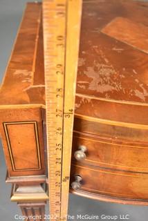 Two Drawer Sheraton Style Mahogany End Table With Inlay And Brass Pulls.  Damage to finish.  27"L x 27"H x 20"W