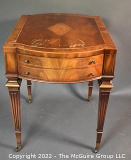 Two Drawer Sheraton Style Mahogany End Table With Inlay And Brass Pulls. Damage to finish. 27"L x 27"H x 20"W