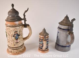 Collection of Three (3) German Steins with Hinged Pewter Lids. 