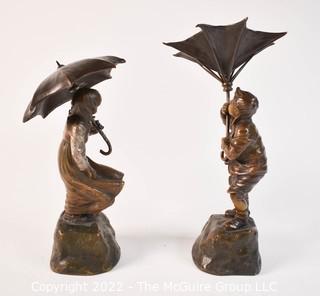 Pair of Cast Bronze Statues of Boy and Girl with Umbrellas.  7" tall.