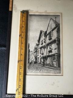 Framed Streetscape engraving in Black and White. Possibly German. Writing on lower margin.  Image Measures 6 x 11". With frame, 13.5 x 18.5" 