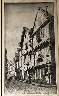 Framed Streetscape engraving in Black and White. Possibly German. Writing on lower margin.  Image Measures 6 x 11". With frame, 13.5 x 18.5" 