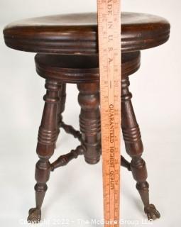 Victorian Piano Stool with Claw Feet Holding Glass Ball. 20" tall.