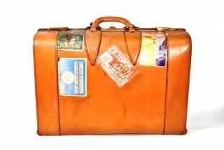 Vintage Saddle Leather Suitcase with Travel Stickers