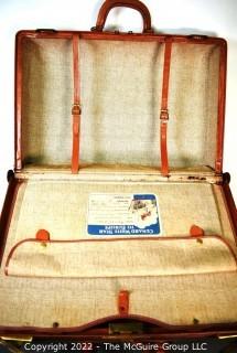 Vintage Saddle Leather Suitcase with Travel Stickers