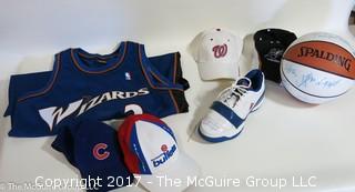 Assortment of sport collectibles including Wizards Jersey signed by Juan Dixon, signed shoe, signed basketball by various Washington Wizards and caps 