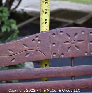 Antique Wood Slat Double Seat Folding Theater Chairs with Carved Back. Metal foot brackets for mounting. 49"L x 32"T 