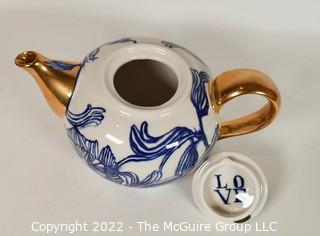 Ruan Hoffmann for Anthropologie Jardin Des Plantes Blue White Gold LOVE Teapot with Two (2) Coordinating Blue Teacups and Saucers. 