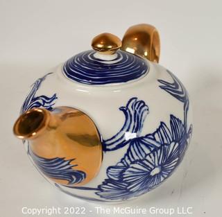 Ruan Hoffmann for Anthropologie Jardin Des Plantes Blue White Gold LOVE Teapot with Two (2) Coordinating Blue Teacups and Saucers. 