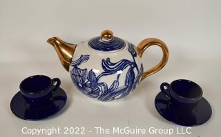 Ruan Hoffmann for Anthropologie Jardin Des Plantes Blue White Gold LOVE Teapot with Two (2) Coordinating Blue Teacups and Saucers. 