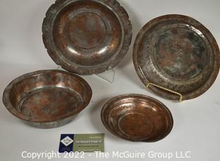 Set of Four (4) Primitive Hammered Copper Plates or Bowls. 