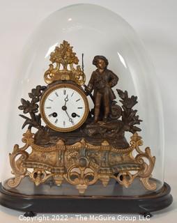 French Antique S Marti et Cie- Medaille de Bronze Clock with Boy and Fishing Pole on Base with Glass Dome Cloche.  13"tall excluding cloche. 