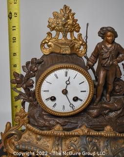 French Antique S Marti et Cie- Medaille de Bronze Clock with Boy and Fishing Pole on Base with Glass Dome Cloche.  13"tall excluding cloche. 