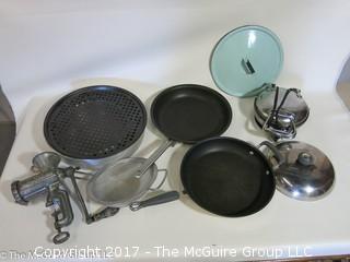 Collection of kitchenware including vintage meat grinder, waffle iron and KitchenAid pot