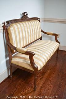 French 19th Century Open Arm Petite Settee With Carved Cartouche Of Love Symbols On Turned Legs.