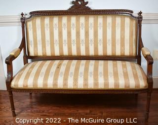 French 19th Century Open Arm Petite Settee With Carved Cartouche Of Love Symbols On Turned Legs.