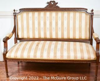 French 19th Century Open Arm Petite Settee With Carved Cartouche Of Love Symbols On Turned Legs.