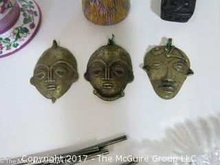 Collection including silver cocktail spoons, ceramics, wall clock and miniature face masks 