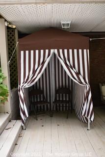 Pop-up Striped Cabana Tent with Two Folding Chairs. 