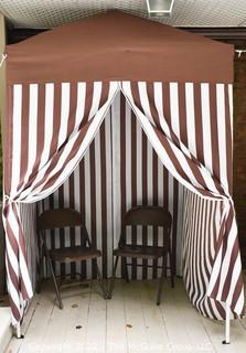 Pop-up Striped Cabana Tent with Two Folding Chairs. 