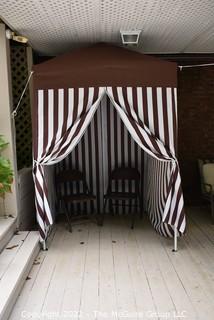 Pop-up Striped Cabana Tent with Two Folding Chairs. 