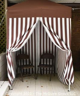 Pop-up Striped Cabana Tent with Two Folding Chairs. 