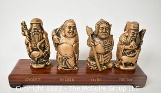 Four (4) Chinese Elders made of Resin on Riser. 