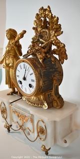 Early 19th Century Empire Style Gilt and Patinated Bronze Mantle Clock with Woman on Alabaster Base . 15"tall