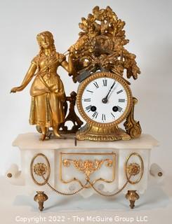 Early 19th Century Empire Style Gilt and Patinated Bronze Mantle Clock with Woman on Alabaster Base . 15"tall