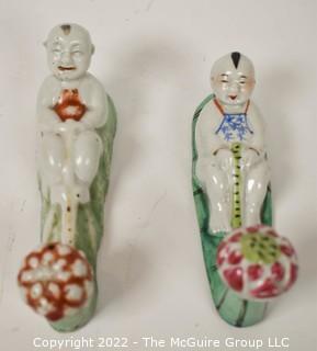 Two (2) Hand Painted Porcelain Chinese Figural Wall Mount Clothing Wall Hooks.  7" long