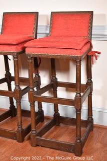 Two (2) Red Upholstered Spanish Style Bar Stools with Brass Tacks