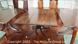 Large 19th Century Georgian Mahogany Extending Three (3) Pedestal Dining Table and Eight (8) Dining Chairs with Green Upholstery.  120" long and 51" wide..  Includes two (2) additional leaves .  Can be detached to form three separate tables