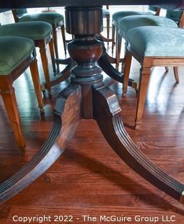 Large 19th Century Georgian Mahogany Extending Three (3) Pedestal Dining Table and Eight (8) Dining Chairs with Green Upholstery.  120" long and 51" wide..  Includes two (2) additional leaves .  Can be detached to form three separate tables