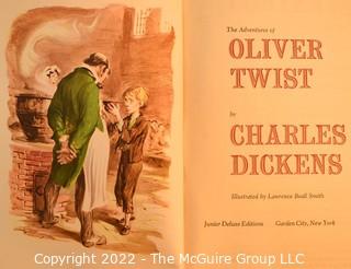 Seven (7) Books Including The Man Who Knew Kennedy, More Stories to Remember, Complete Works of Shakespeare, Dickens Oliver Twist and Kristin Labransdatter. 