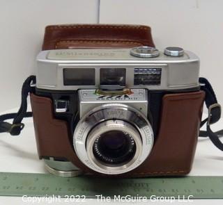 Vintage Kodak Motormatic 35mm film camera with leather case