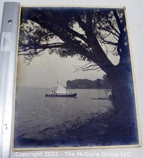 Untitled unmounted vintage photo unattributed of a canoe with sail on water (circa 1920's)